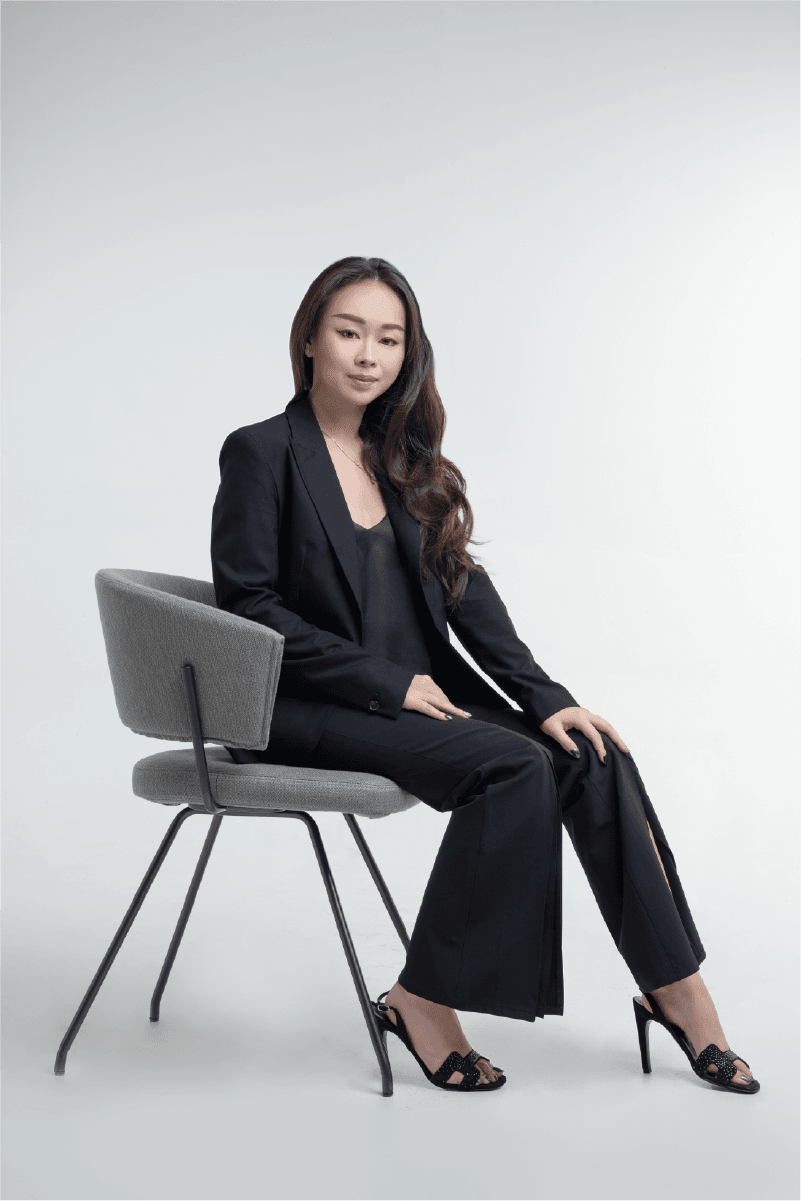Claudia Apriliana sitting on a modern chair